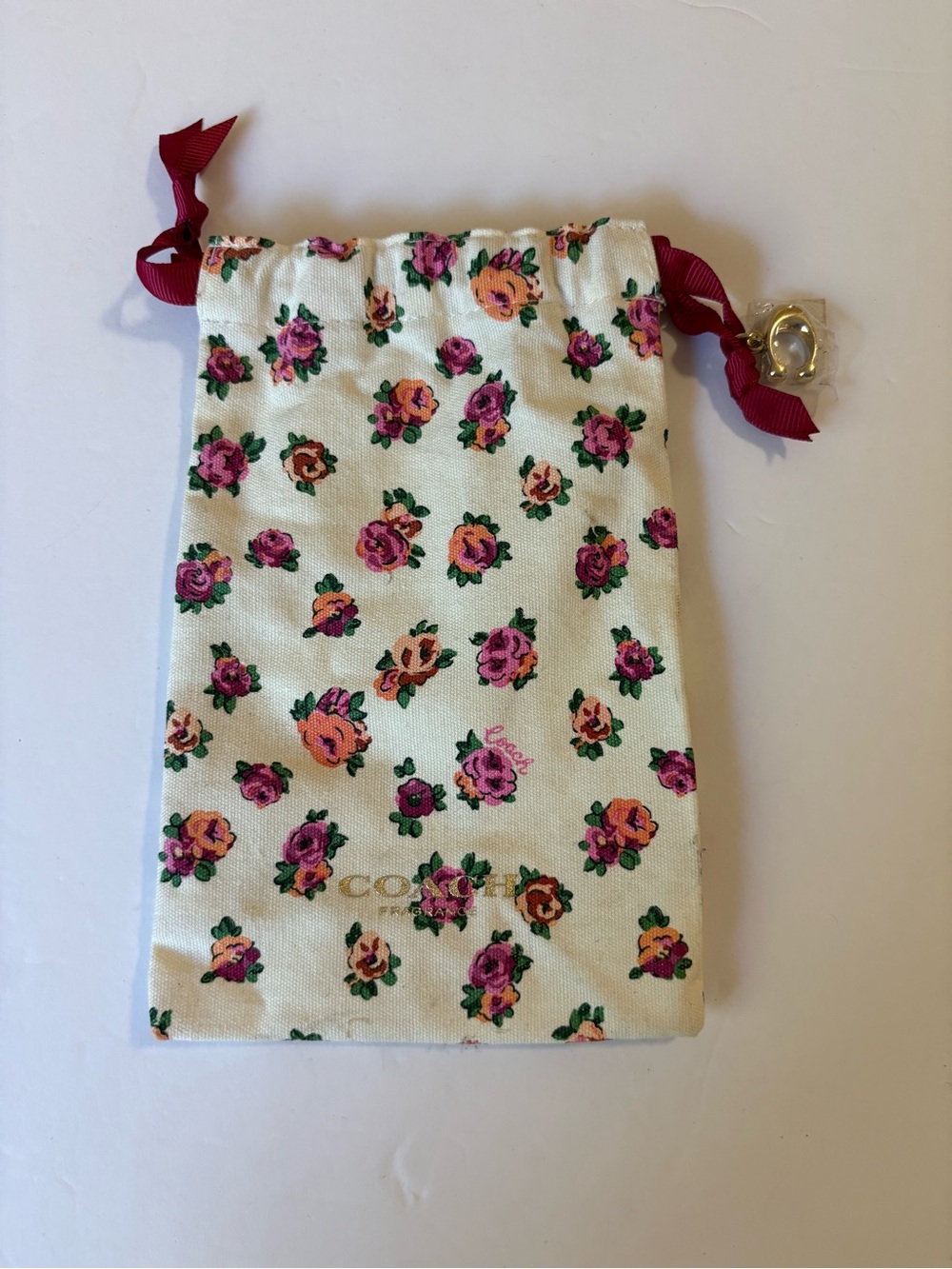 Coach Floral Drawstring Pouch in Cream with Pink & Orange Roses